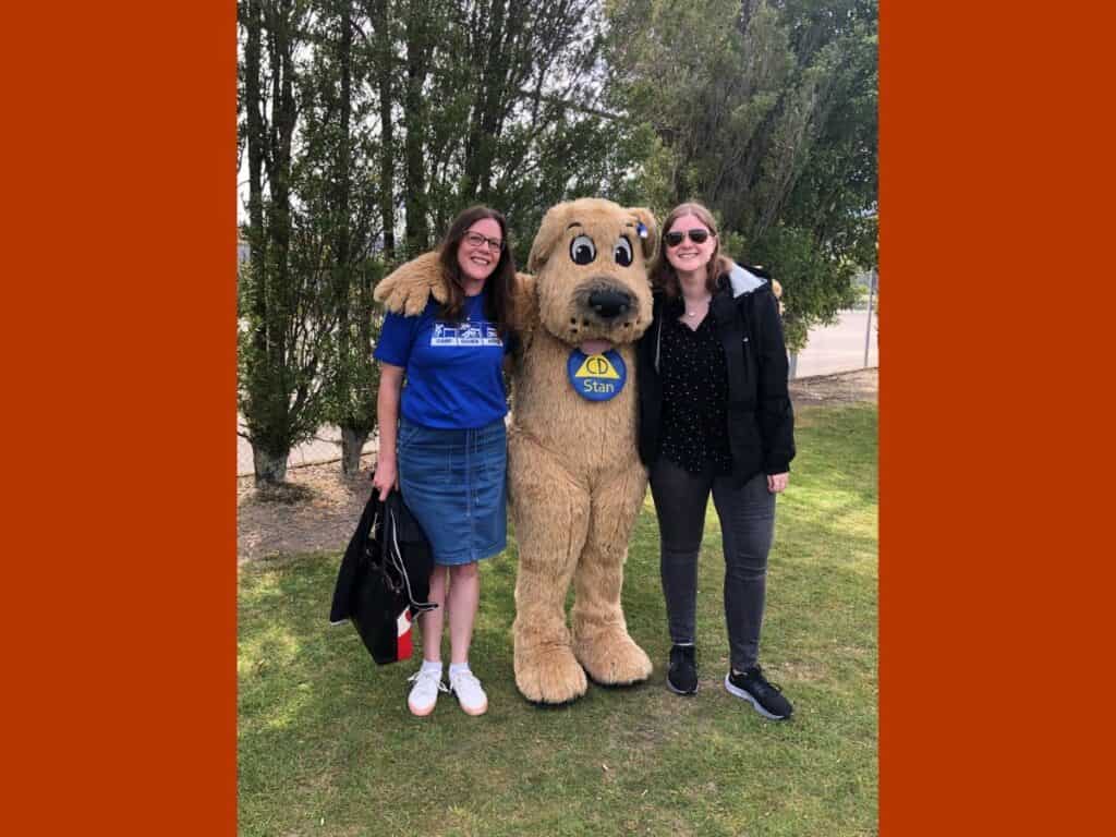 Julia Becker and Lauren Vinnell with NEMA's mascot Stan